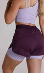 Short fitness com bermuda interna e bolsos laterais
