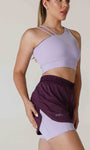 Short fitness com bermuda interna e bolsos laterais