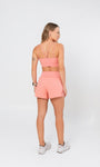 Short soltinho com bermuda interna e bolsos laterais